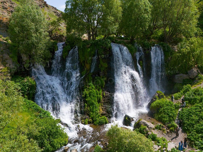 Several waterfalls surrounded by dense greenery and trees, aerial view, Shaki waterfall, Shaki, Syunik province, Armenia