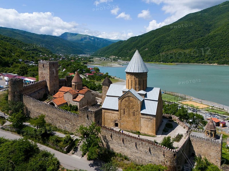 Historic fortress above a reservoir, surrounded by green hills in an idyllic setting, aerial view, Ananuri Castle, Zhinvali Reservoir, Shinvali, Jinvali or Shinvali, Mtskheta-Mtianeti Region, Georgian Military Road, Georgia