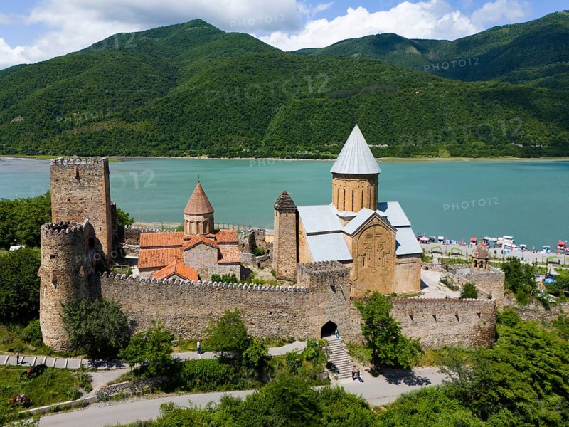 Medieval castle landscape by a body of water with green hills and peaceful atmosphere, aerial view, Ananuri Castle, Zhinvali Reservoir, Shinvali, Jinvali or Shinvali, Mtskheta-Mtianeti region, Georgian Military Road, Georgia