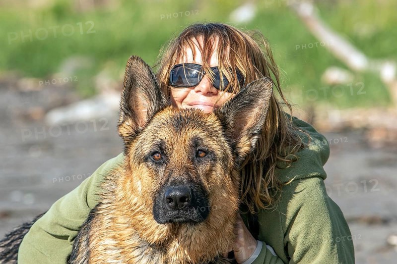 Woman hugging her German Shepherd, Gaspesie Region, Province of Quebec, Canada, North America
