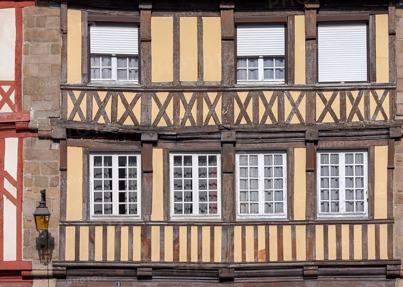 Close-up of a half-timbered house with beige and brown elements, Tréguier, Brittany, France