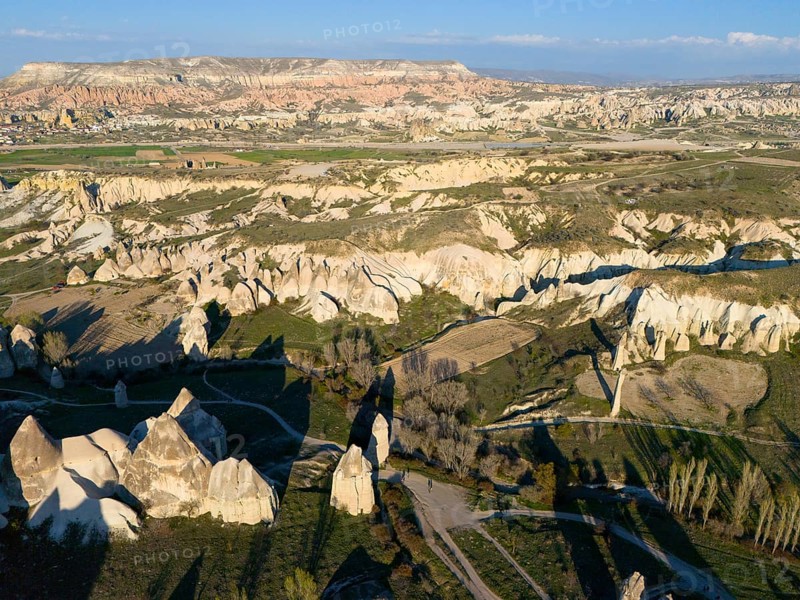 Vast landscape with hills and unique rock formations in the sunlight, aerial view, Göreme National Park, Göreme Tarihî Millî Parki, Nevsehir Province, Nevsehir, Cappadocia, Cappadocia, Cappadocia, Cappadocia, Central Anatolia, Turkey