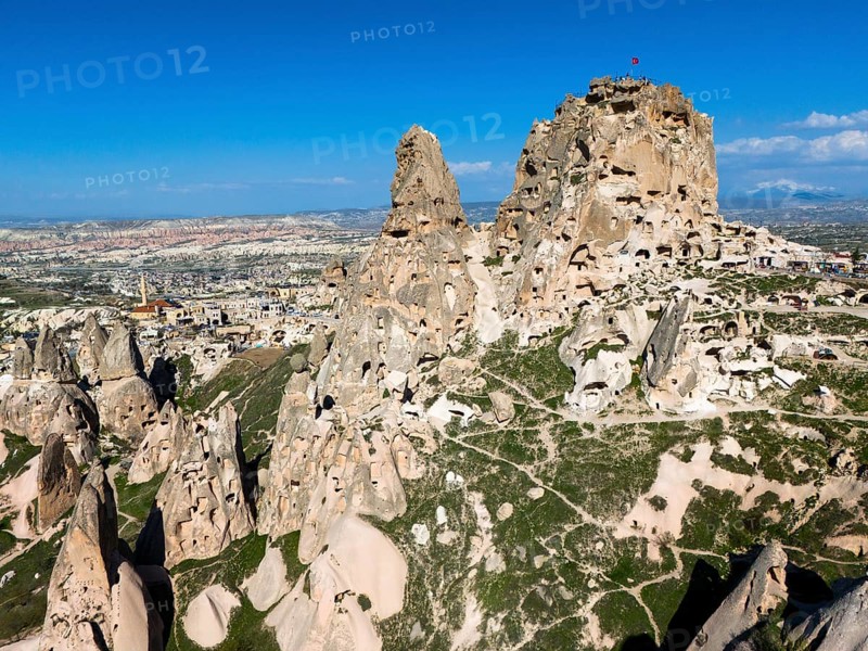 Rocky landscape with ancient rock structures under a clear blue sky in Cappadocia, aerial view, Uchisar Castle, Uçhisar Kalesi, impressive rock formation and fortress, Göreme National Park, Göreme Tarihî Millî, Nevsehir Province, Nevsehir, Cappadocia, Cappadocia, Kapadokya, Cappadocia, Central Anatolia, Turkey