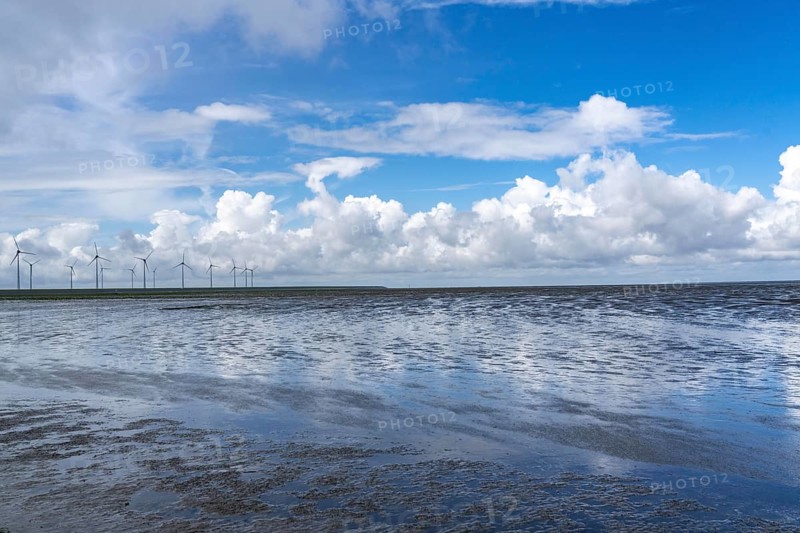 Wadden Sea between the Dutch coast near Eemshaven and the German North Sea island of Borkum, Wadden Sea National Park, UNESCO World Heritage Site, low tide, wind farm, low tide, clouds