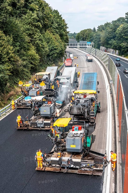 Rehabilitation of the A52 motorway near Essen, an 8 km long section between the Essen-Kettwig junction and the Essen-Ost motorway junction was completely renovated over a period of 9 years, 6 lanes, new drainage pipes, carriageway, bridges, noise barriers, traffic facilities, here the last section, direction Düsseldorf, new carriageway surface, laying of porous asphalt, whispering asphalt, at the Essen-Rüttenscheid junction, North Rhine-Westphalia, Germany
