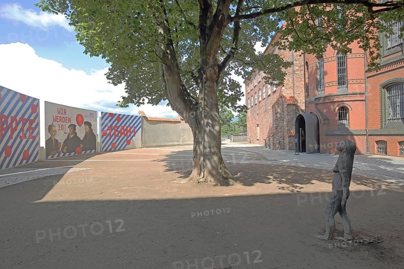 European Hanseatic Museum with sculpture Mary Magdalene by Kiki Smith 1994, banner, historic brick building, inner courtyard, Marstallweg, Old Town, Lübeck, Schleswig-Holstein, Germany