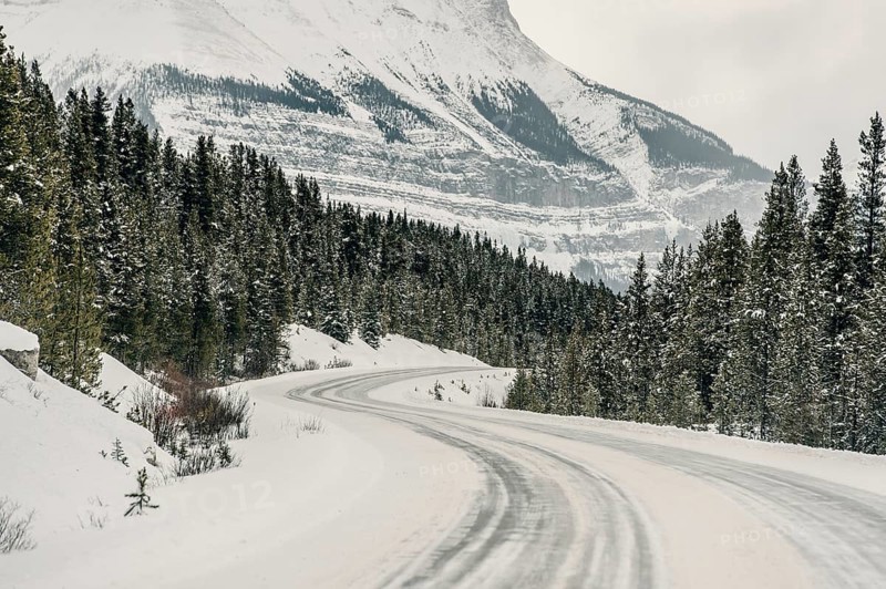 Winter road trip on the Icefields Parkway with lots of snow and ice, Banff National Park, Jasper National Park, Alberta, Canada