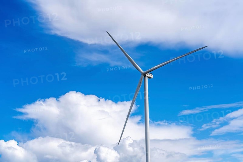 Strekdammen Wind Farm, wind farm at the seaport of Eemshaven in the Netherlands, built on offshore breakwaters, 2 GE Cypress 5, 5 MW turbines, with 158 metre blade diameter, together produce 11 MW of power, can supply 15, 500 households with electricity from wind, cumulus cloud over the North Sea, Netherlands