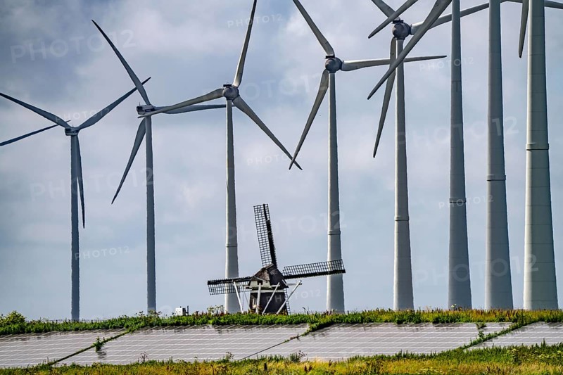 Westereems and Growind wind farms, over 80 wind turbines in total, at the seaport of Eemshaven, province of Groningen, in the north-west of the Netherlands, historic Goliath windmill from 1897, solar farm on sea dike, Slaperdijk, a good 5 kilometres long