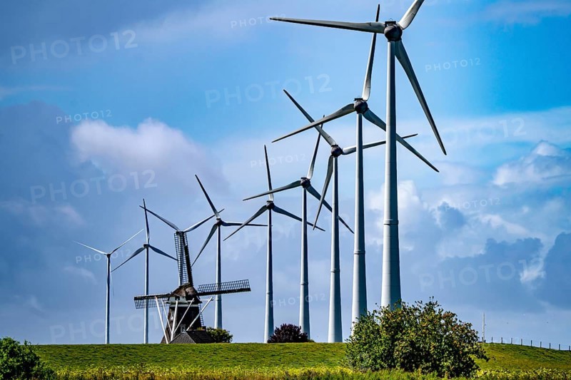 Westereems and Growind wind farms, over 80 wind turbines in total, at the Eemshaven seaport, province of Groningen, in the north-west of the Netherlands, historic Goliath windmill from 1897