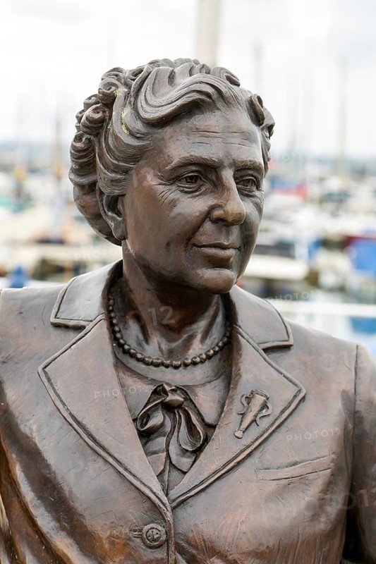 Bronze sculpture statue artwork Agatha Christie close up detail, Torquay, Devon, England, UK by artist Elisabeth Hadley 2024