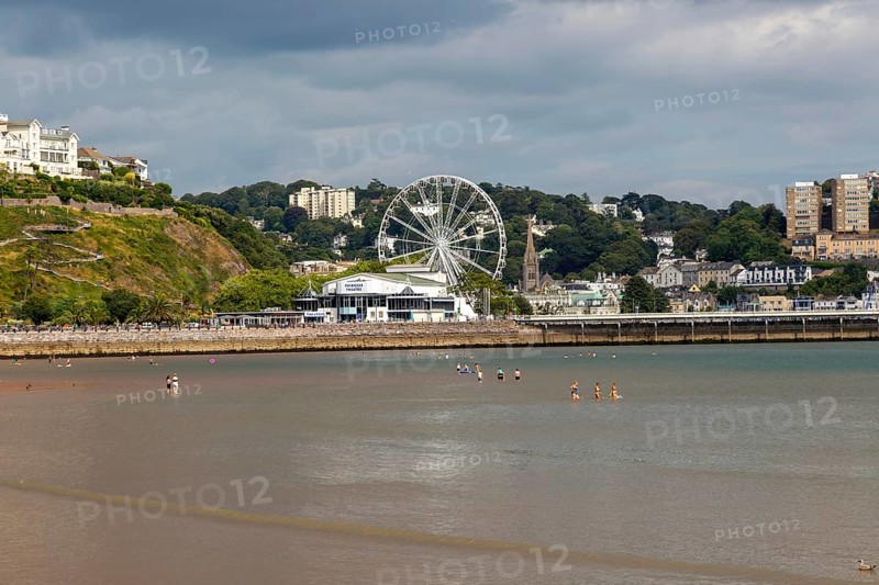 View to Princess Theatre and Ferris Wheel, Torre Abbey Sands sandy beach, Torquay, Devon, England, UK