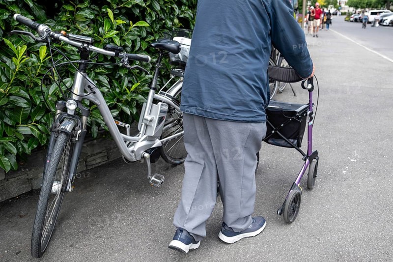 Senior citizen with walking aid, Interlaken, Bern, Switzerland