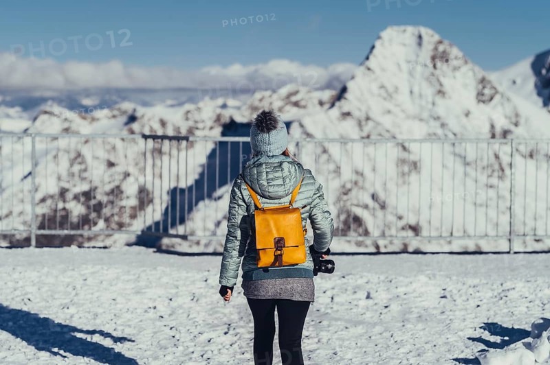 Woman in wintry surroundings in the Engadine in Switzerland