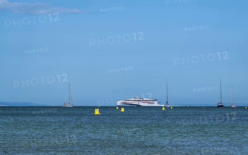 Boats on sea over Knoll Beach Studland, Poole, Dorset, England, United Kingdom