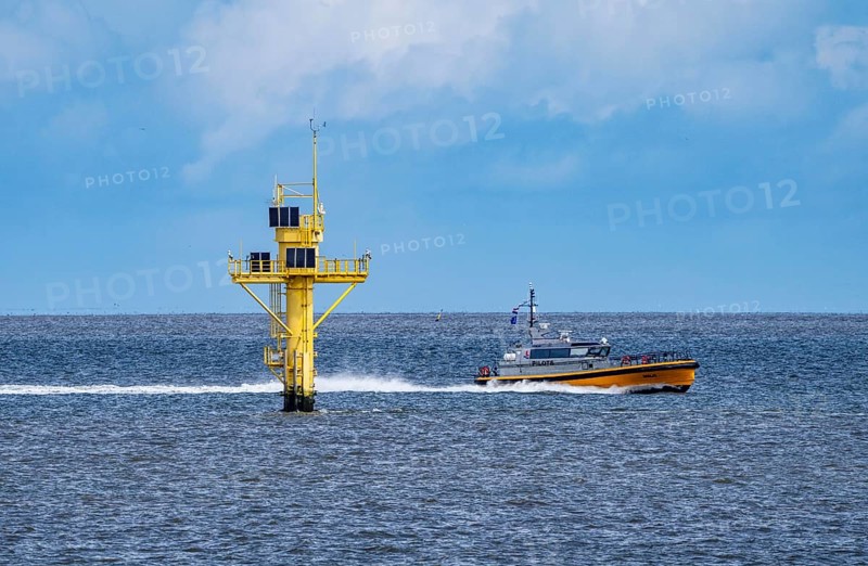 Pilot boat, Milo, pilot boat, brings sea pilots, ship pilots, to the ships to ensure safe entry and exit to the harbour, here in front of the Eemshaven seaport, Ems estuary, Netherlands