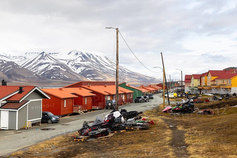 Colourful wooden houses, street, skidoos, Longyearbyen, Spitsbergen, Svalbard