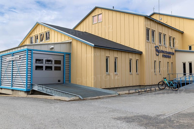 Hospital, yellow wooden house, Longyearbyen, Spitsbergen, Svalbard