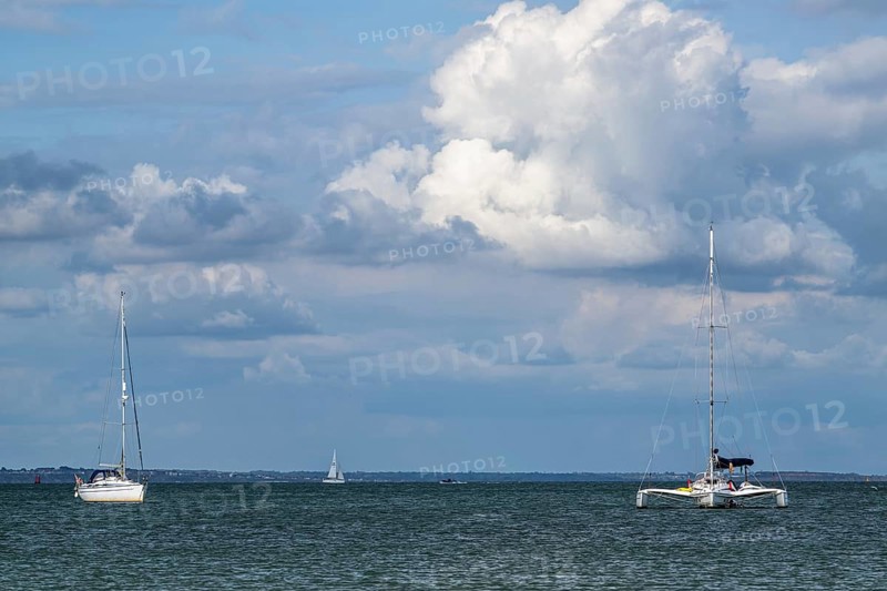 Boats on sea over Knoll Beach Studland, Poole, Dorset, England, United Kingdom