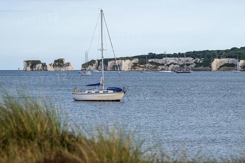 Boats on sea over Knoll Beach Studland, Poole, Dorset, England, United Kingdom