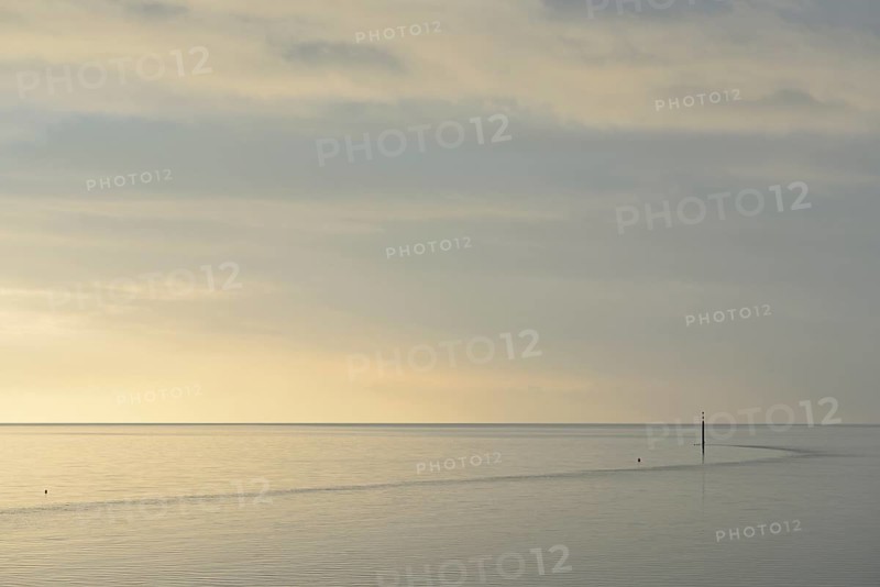Wadden Sea at rising water, stone groyne with sea mark, North Sea, Norddeich, Lower Saxony, Germany
