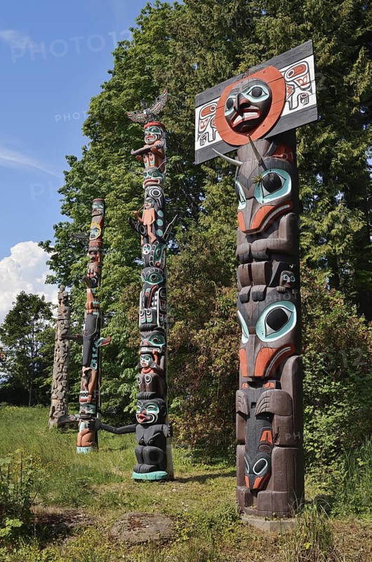 Totem poles, Chief Skedans Mortuary Totem Pole and Ga'akstalas Totem Pole, Stanley Park, Vancouver, British Columbia, Canada