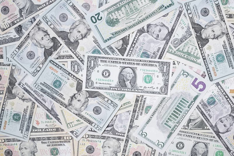 Various US dollar notes in a pile, banknotes