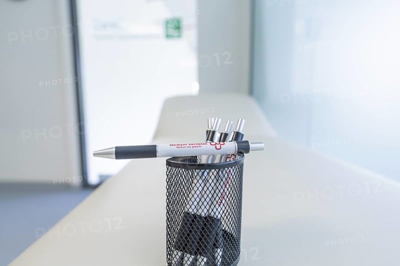Pen holder with pens on a desk in a modern office, Care Connect, vaccination kiosk for refugees, Calw, Germany