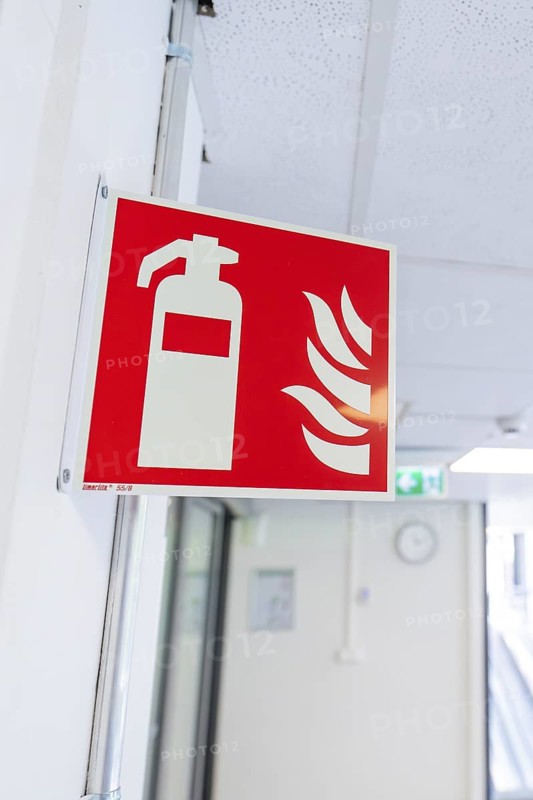 Fire extinguisher sign in an office corridor as a safety instruction, Care Connect, vaccination kiosk for refugees, Calw, Germany