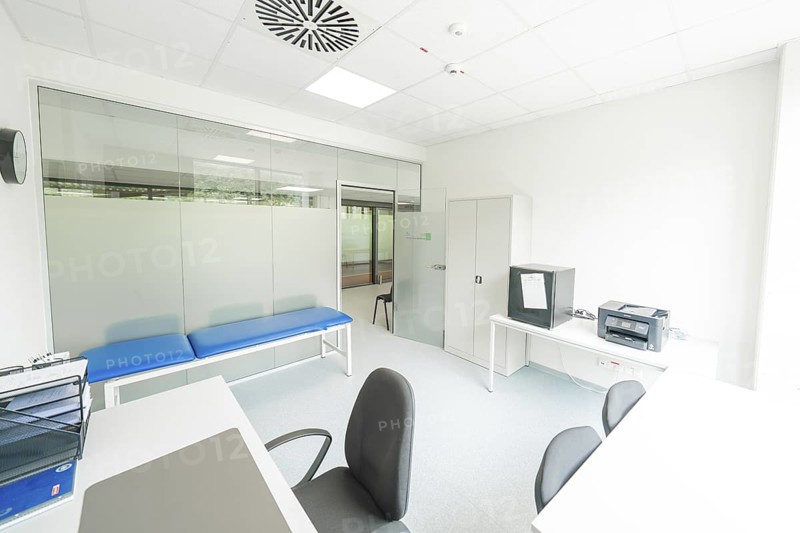 A bright examination room with couch and desk, Care Connect, vaccination kiosk for refugees, Calw, Germany