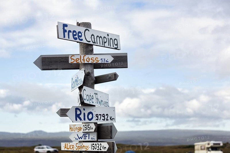 Signposts, signs, free camping, free WIFI, distance to Selfoss, Cape Town, Rio and Alice Springs, campsite in Selvogur, South Coast, Iceland