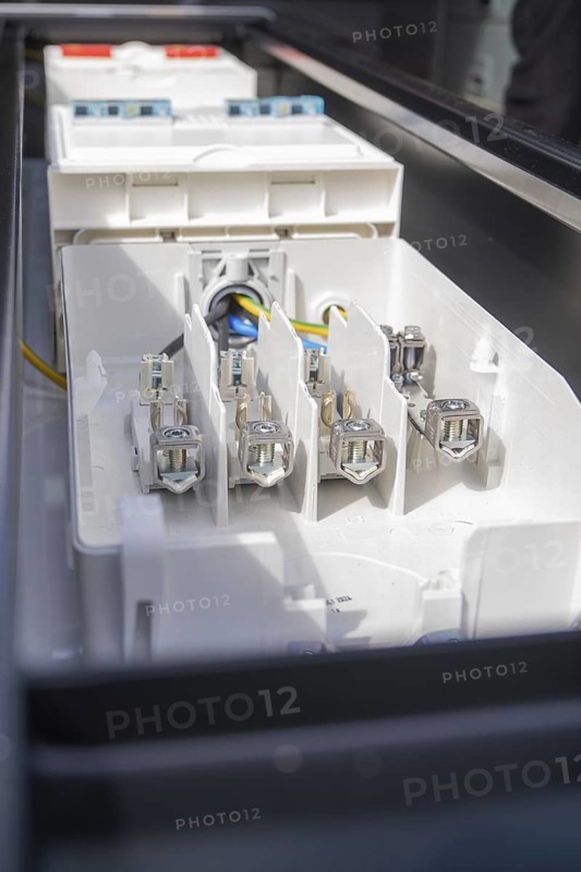 Detailed image of connections in an electrical device, assembly of a charging station for electric cars, Calw, Germany
