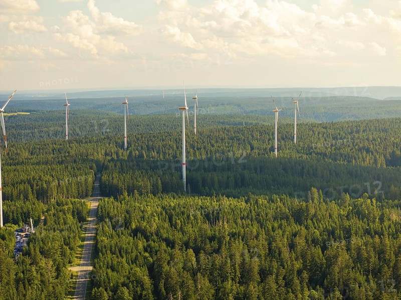 Wind turbines in a wide forest landscape under a cloudy sky, Simmersfeld, Black Forest, Germany