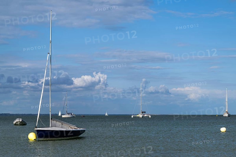 Boats on sea over Knoll Beach Studland, Poole, Dorset, England, United Kingdom