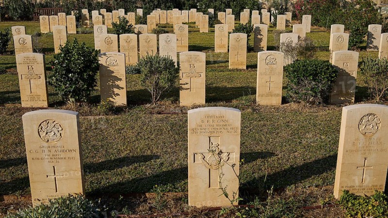 Rows of carefully tended gravestones in a cemetery in sunlight with green vegetation, Military Cemetery, Commonwealth War Cemetery, Military Cemetery, WW2, 1939-1945, 179 graves, Alinda, Leros, Dodecanese, Greek Islands, Greece