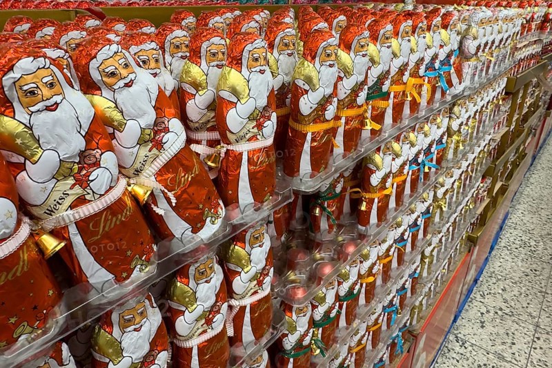 Huge large shelf with chocolate Santa Claus chocolate Santa Claus chocolate Santa Claus chocolate Santa Claus sweets from Lindt brand, international