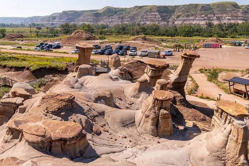 Breathtaking panorama featuring unique hoodoo rock formations in drumheller valley, highlighting the geological wonders of the canadian badlands on a sunny day