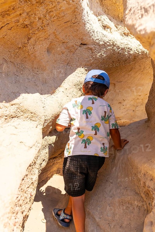 Young adventurer discovering extraordinary sandstone formations in drumheller, canada, while immersing in the breathtaking natural wonders of the canadian badlands