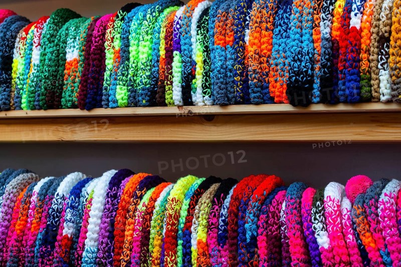 Colourful woolen hats on the shelf, Christmas market, city of Esslingen, district of Esslingen, Baden-WÃ¼rttemberg, Germany