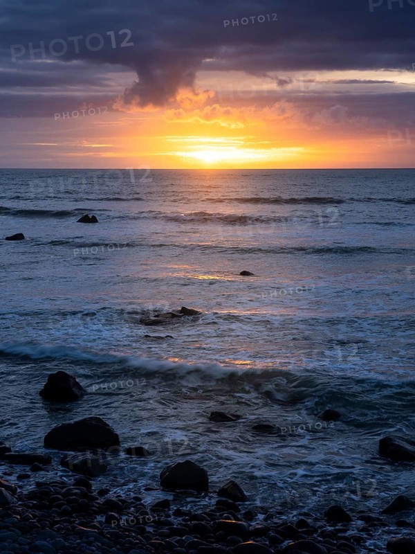 Sea in the evening at sunset, west coast of the Taranaki region, North Island, New Zealand