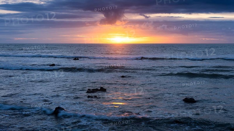 Sea in the evening at sunset, west coast of the Taranaki region, North Island, New Zealand
