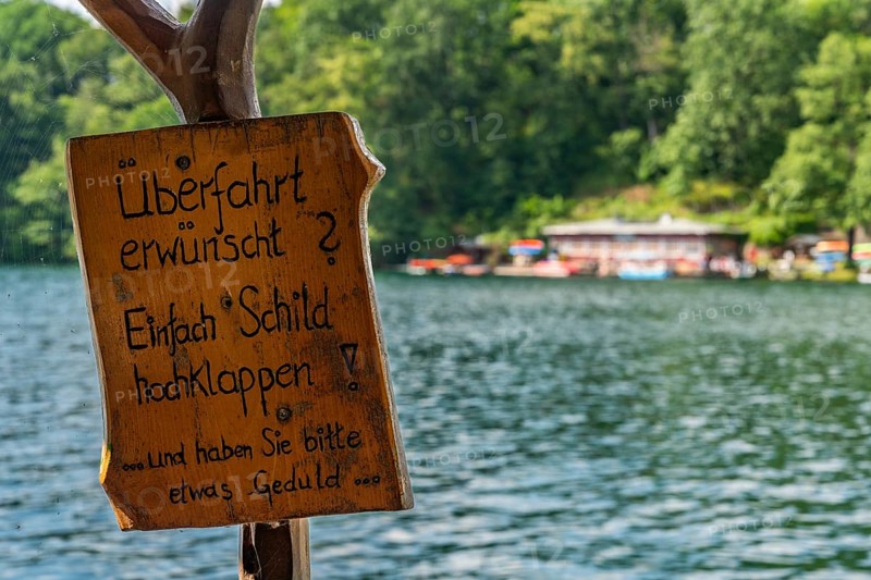 Crossing sign required, ferry station, canoe rental and cafÃ© am See Schmaler Luzin, Hullerbusch Nature Reserve, Feldberg, Feldberger Seenlandschaft, Mecklenburg Lake District in Mecklenburg-Western Pomerania, Germany