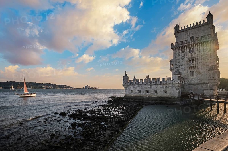 Belem Tower or Tower of St Vincent - famous tourist landmark of Lisboa and tourism attraction - on the bank of the Tagus River Tejo on sunset. Lisbon, Portugal