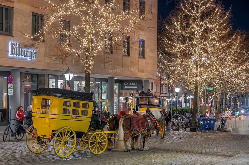 Historic stagecoach rides with horseback during the Nuremberg Christmas Market, Nuremberg, Middle Franconia, Bavaria, Germany