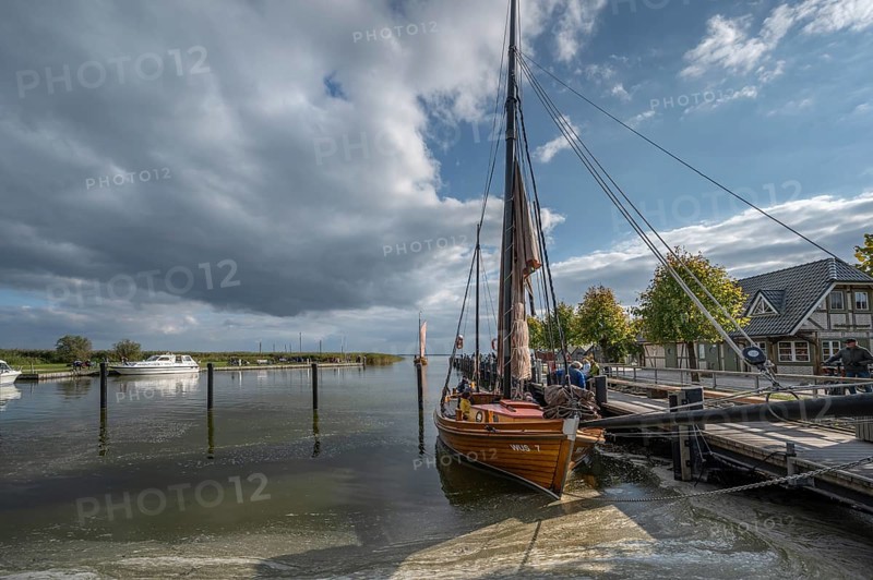 Historic sea boat, formerly used for sailing fishing, anchored in the port of Ahrenshoop, Mecklenburg-Western Pomerania, Germany