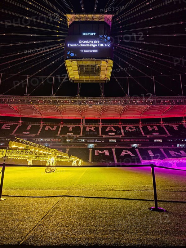 The Frankfurt Waldstadion (Deutsche Bank Park) is illuminated in red to mark the founding of the Women's Bundesliga Association and the video cube reads: Founding of the Women's Bundesliga FBL e.V. - 10 December 2025, Waldstadion, Frankfurt am Main, Hesse, Germany
