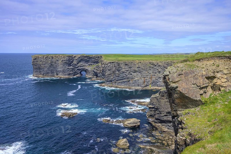 Cliff coast with rock arch, Kilkee, County Clare, Ireland