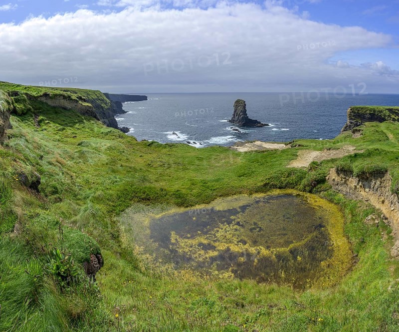 Rock nose in the sea called Candle Stick, Kilkee, County Clare, Ireland