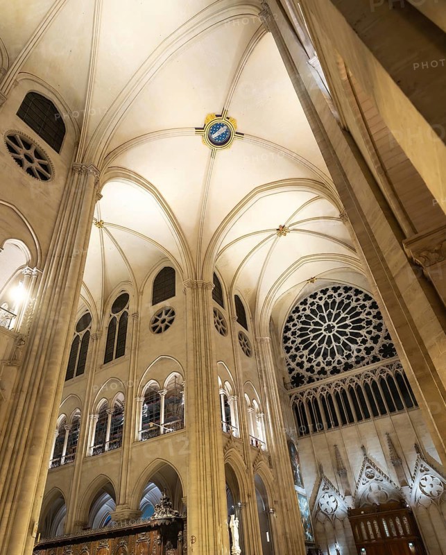 Notre dame de paris cathedral interior showcasing soaring gothic architecture. Pointed arches. Ribbed vaults. And intricate rose windows. Highlighting religious beauty and historical design in france