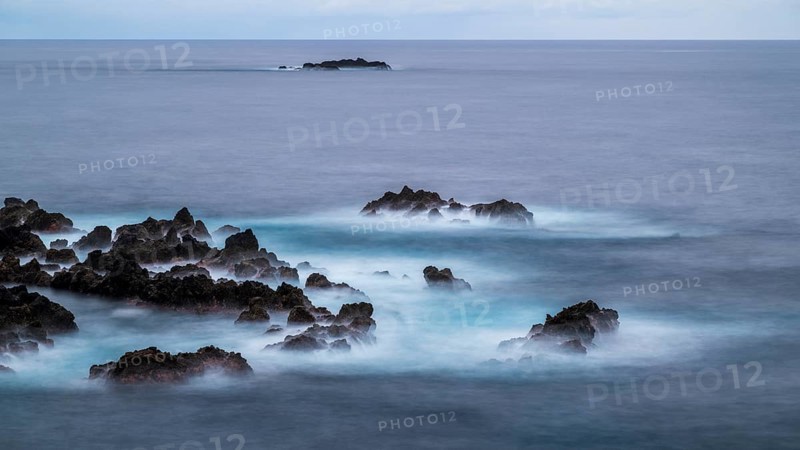 Sunset, long exposure, waves and rocks, coast near Porto Moniz, Madeira, Portugal